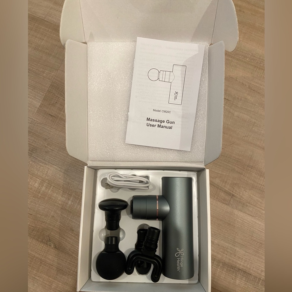 Gray Massage Gun with Attachments